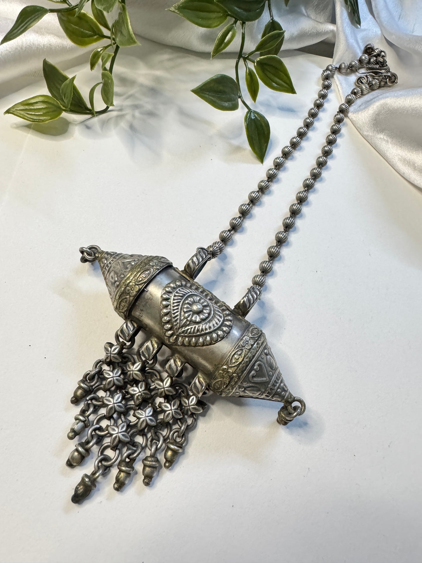 Raksha silverlookalike Neckpiece